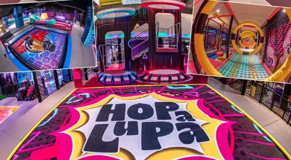 Kolorowy, nowoczesny kryty park rozrywki dla dzieci "Hop La Pa" z mnóstwem atrakcji: trampoliny, zjeżdżalnie, tunele i strefy do zabawy.