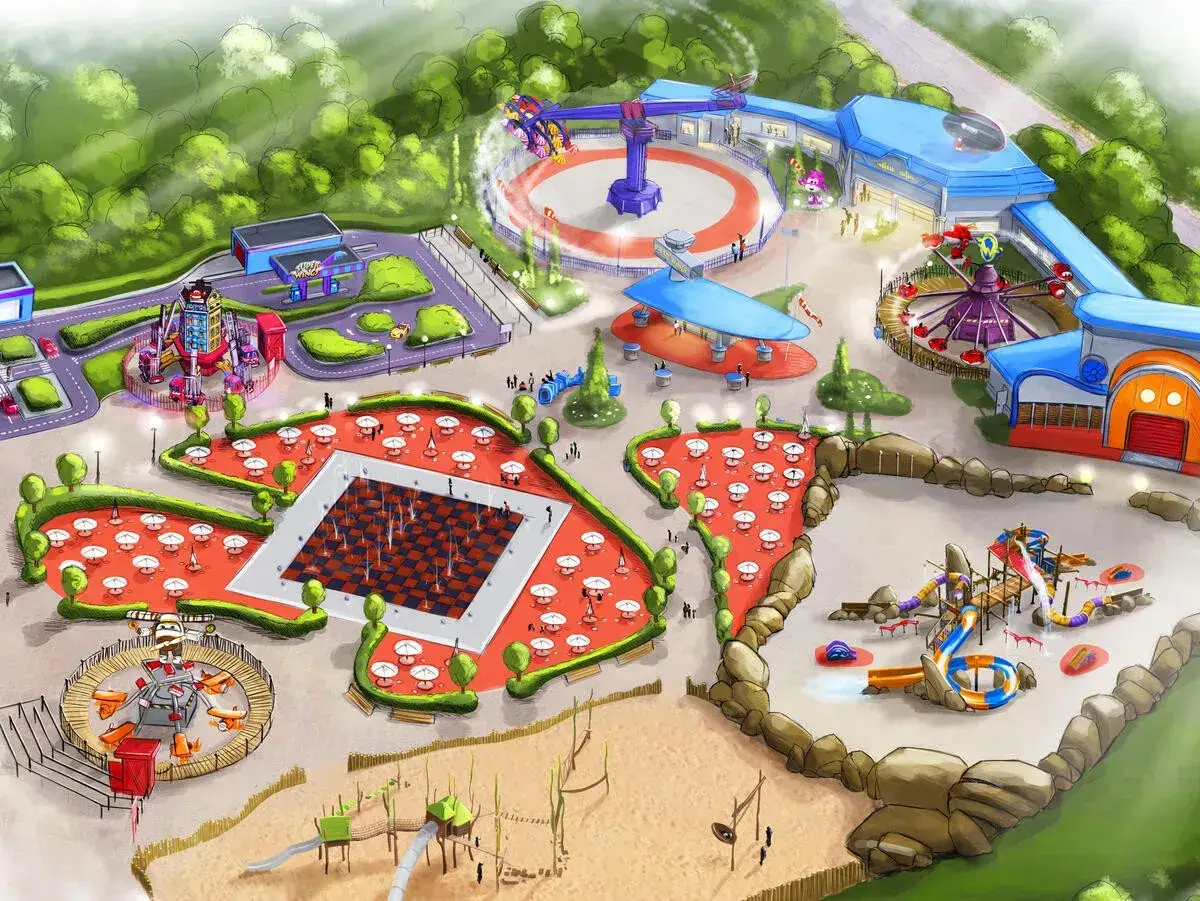 Kolorowy park rozrywki Majaland Gdańsk z karuzelami, zjeżdżalniami i placem zabaw.