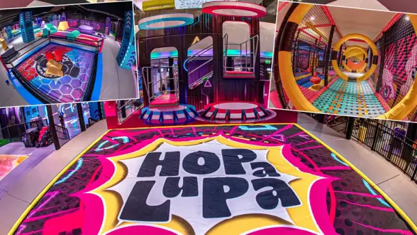 Kolorowy, nowoczesny kryty park rozrywki dla dzieci "Hop La Pa" z mnóstwem atrakcji: trampoliny, zjeżdżalnie, tunele i strefy do zabawy.
