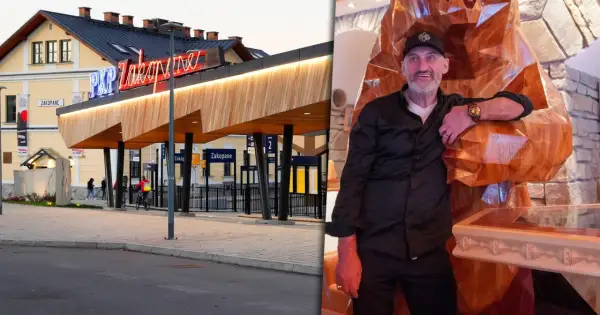 Właściciel księstwa góralskiego pozuje przy rzeźbie w Zakopanem.